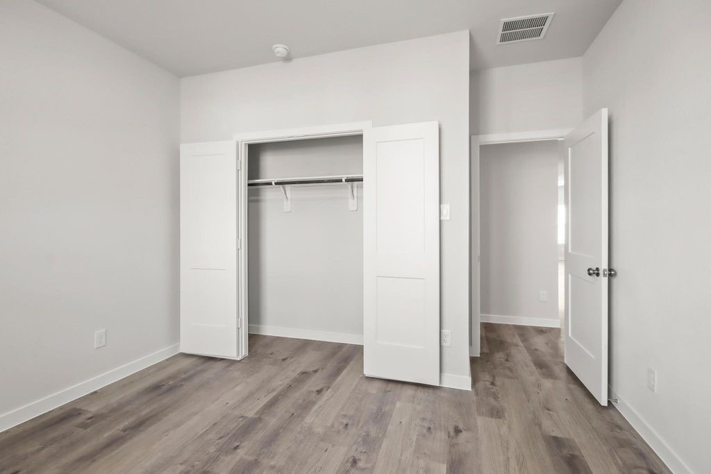 496 Shoreview Drive Conroe, TX 77303 - Photo 12 of 20 a view of empty room with wooden floor