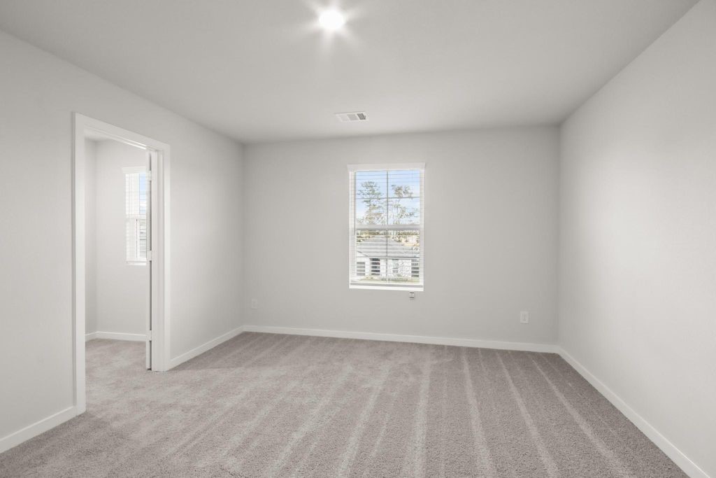496 Shoreview Drive Conroe, TX 77303 - Photo 14 of 20 a view of an empty room with a window