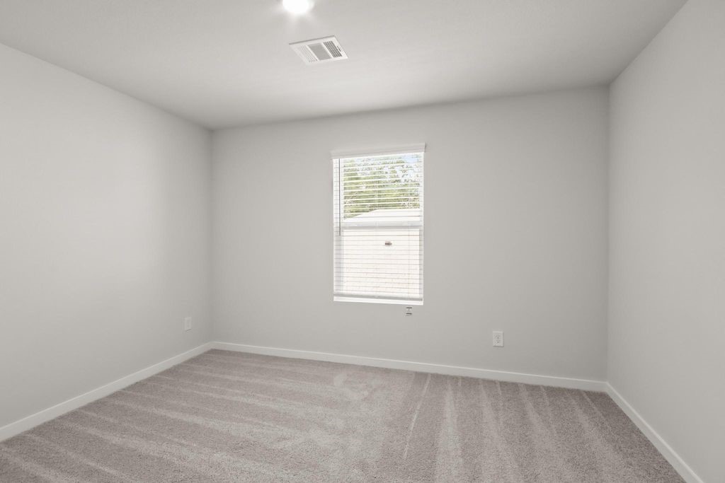 496 Shoreview Drive Conroe, TX 77303 - Photo 17 of 20 an empty room with a window
