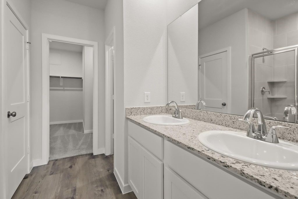 496 Shoreview Drive Conroe, TX 77303 - Photo 9 of 20 a bathroom with a sink and a mirror