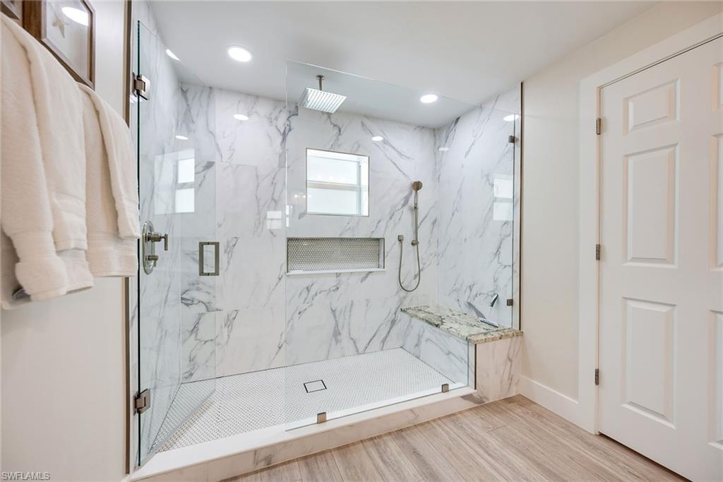 1410 Curlew Avenue Naples, FL 34102 - Photo 20 of 44 a bathroom with a bathtub and a shower