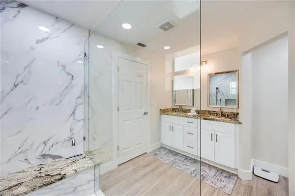 a bathroom with a bathtub and a shower