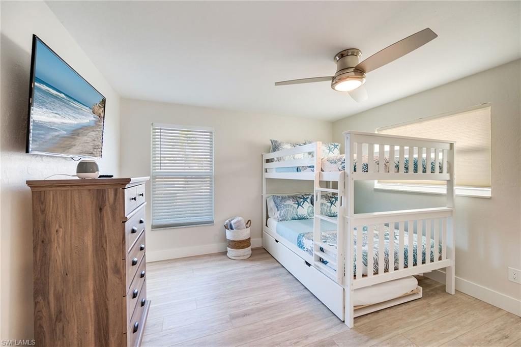 1410 Curlew Avenue Naples, FL 34102 - Photo 25 of 44 a bedroom with furniture and baby crib
