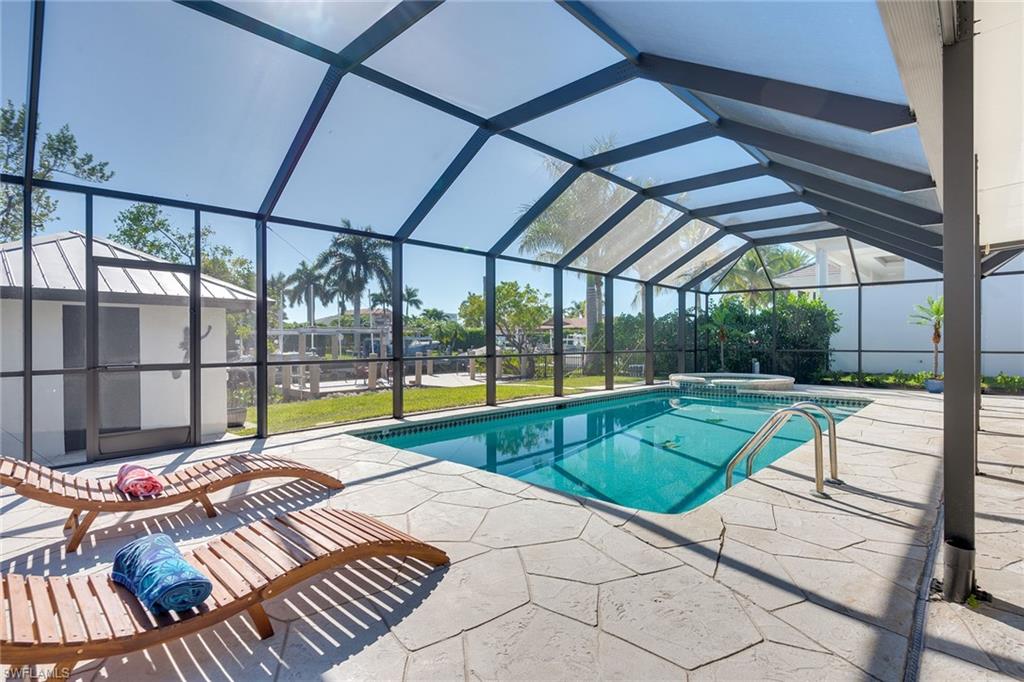 1410 Curlew Avenue Naples, FL 34102 - Photo 28 of 44 a view of swimming pool with lounge chair