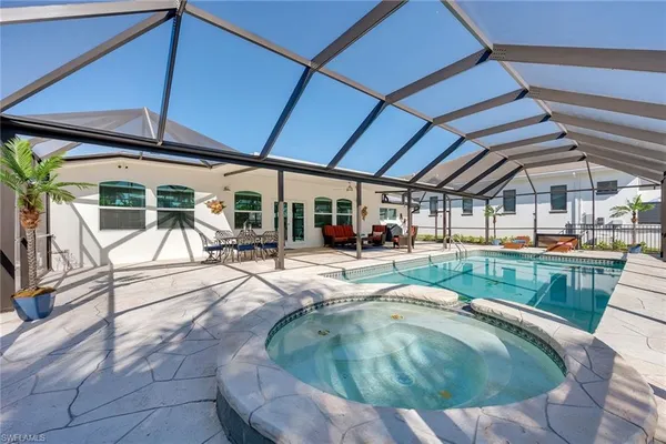 a view of swimming pool with lounge chair