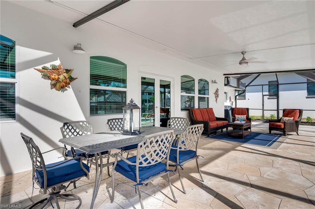1410 Curlew Avenue Naples, FL 34102 - Photo 31 of 44 a living room with furniture and a chandelier