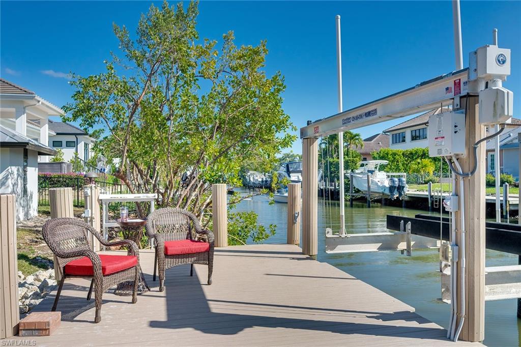 1410 Curlew Avenue Naples, FL 34102 - Photo 36 of 44 a house view with a sitting space and garden view