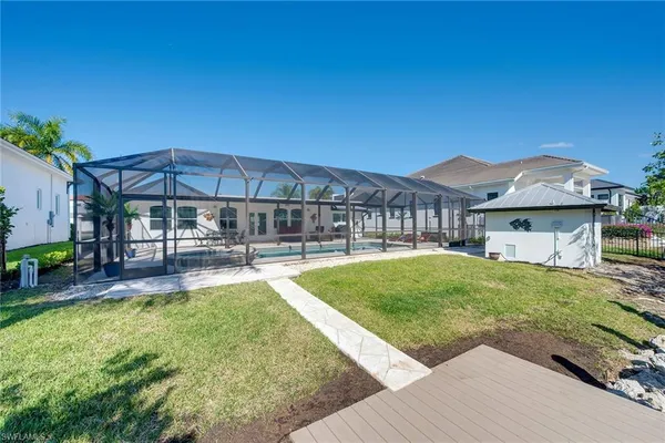 a view of house with outdoor seating and lake