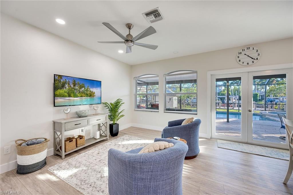 1410 Curlew Avenue Naples, FL 34102 - Photo 3 of 44 a living room with furniture and a flat screen tv