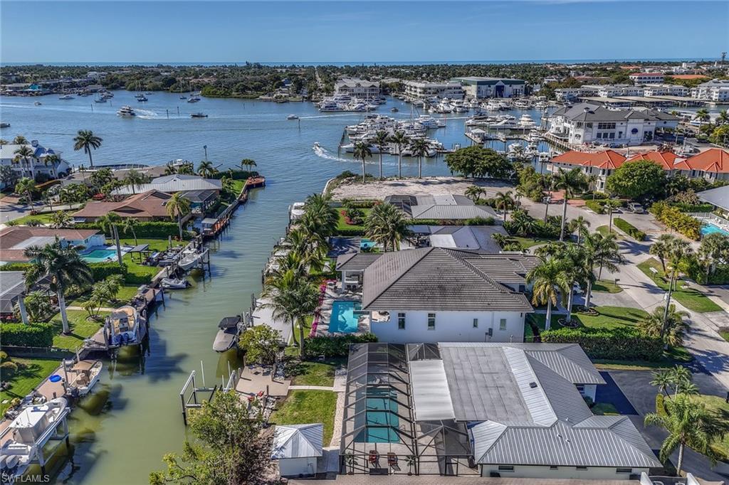 1410 Curlew Avenue Naples, FL 34102 - Photo 42 of 44 an aerial view of a house with a lake view