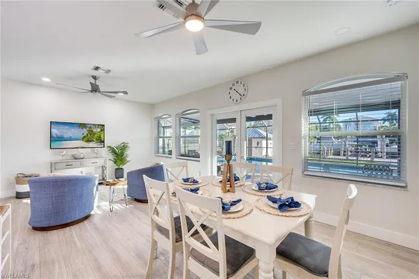 a view of a dining room with furniture window and outside view