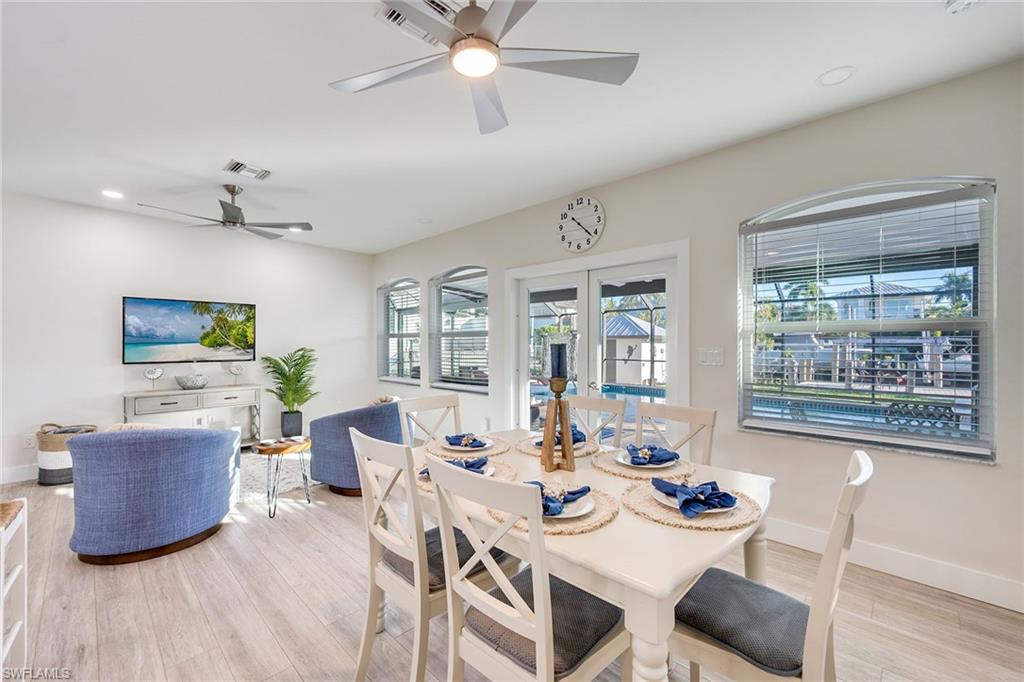 1410 Curlew Avenue Naples, FL 34102 - Photo 6 of 44 a living room with furniture and a large window