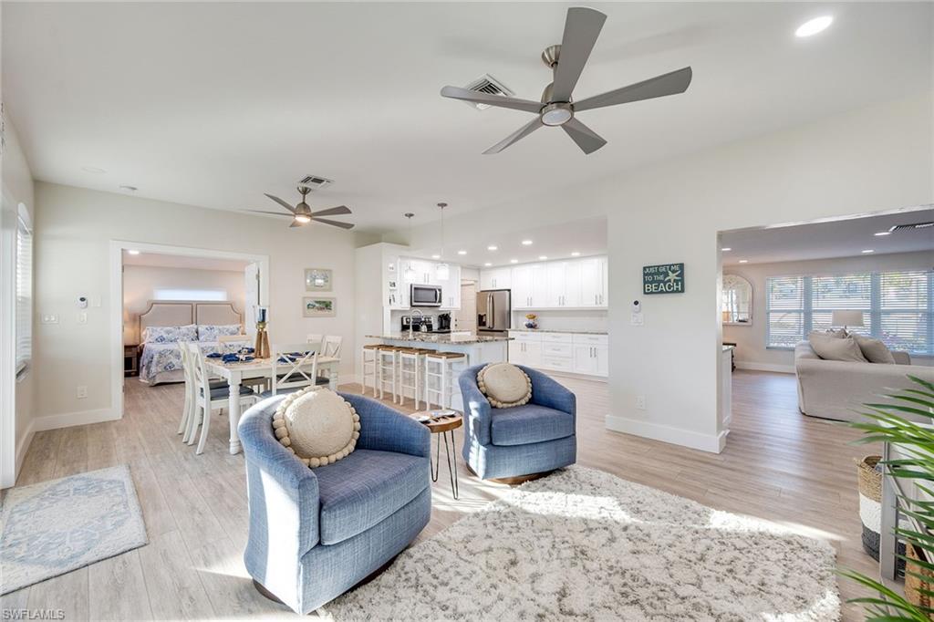 1410 Curlew Avenue Naples, FL 34102 - Photo 7 of 44 a living room with furniture and a view of kitchen