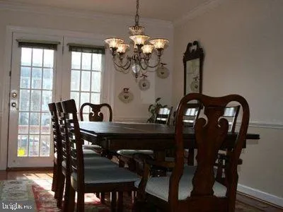 a view of a dining room with furniture and window