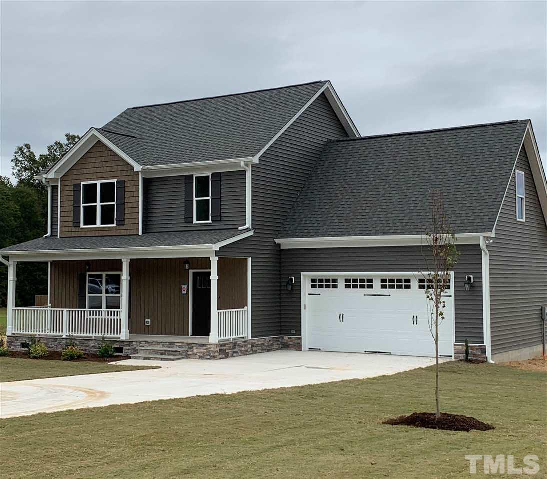 This beautiful home with upgraded siding sits just before the cul de sac on a large .68 acre lot PLUS it has city water and city sewer!!!