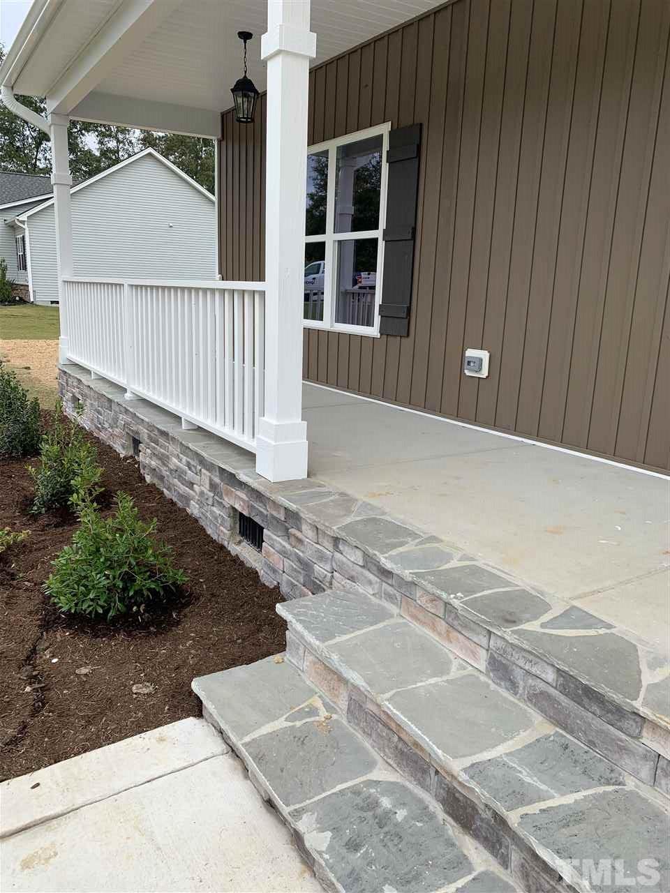 7829 Creech Road Middlesex, NC 27557 - Photo 2 of 18 Relax while sitting on this HUGE covered front porch. It's just waiting for your rocking chairs!