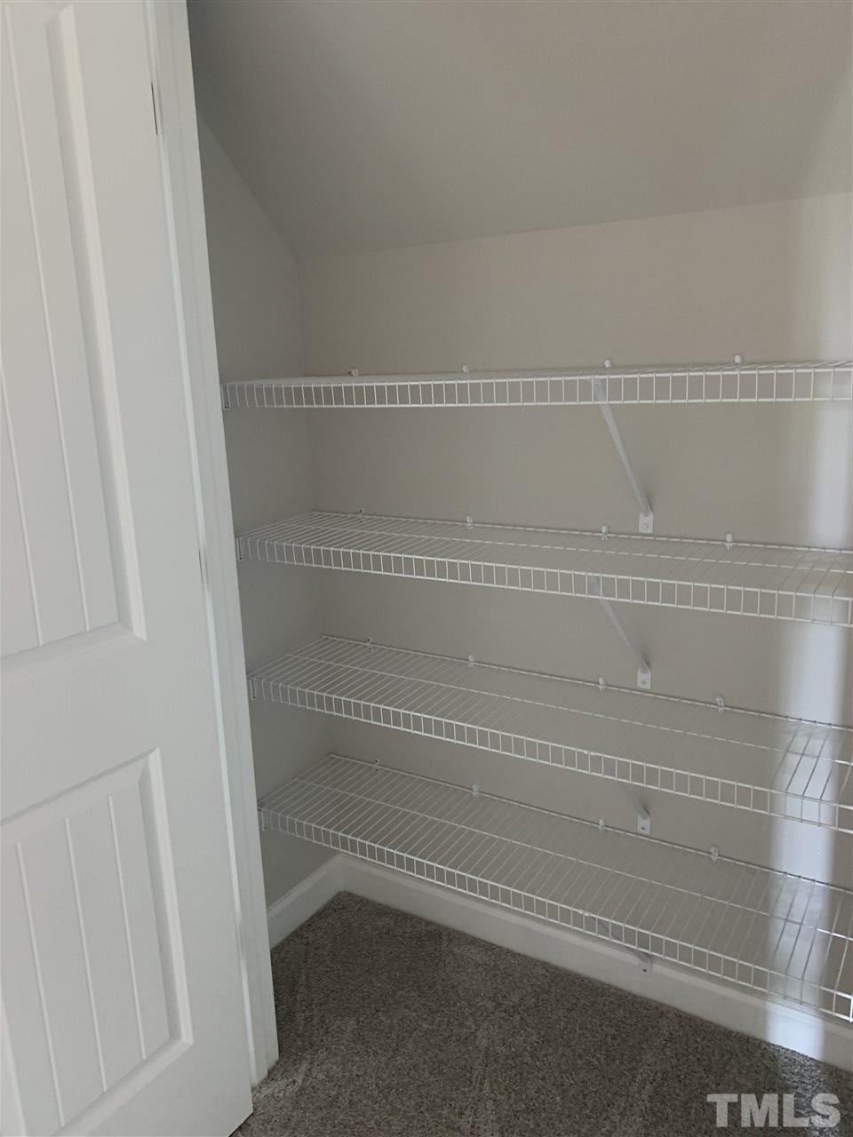 7829 Creech Road Middlesex, NC 27557 - Photo 12 of 18 This Massive Hall Closet is located just outside the bonus room. TONS of storage!
