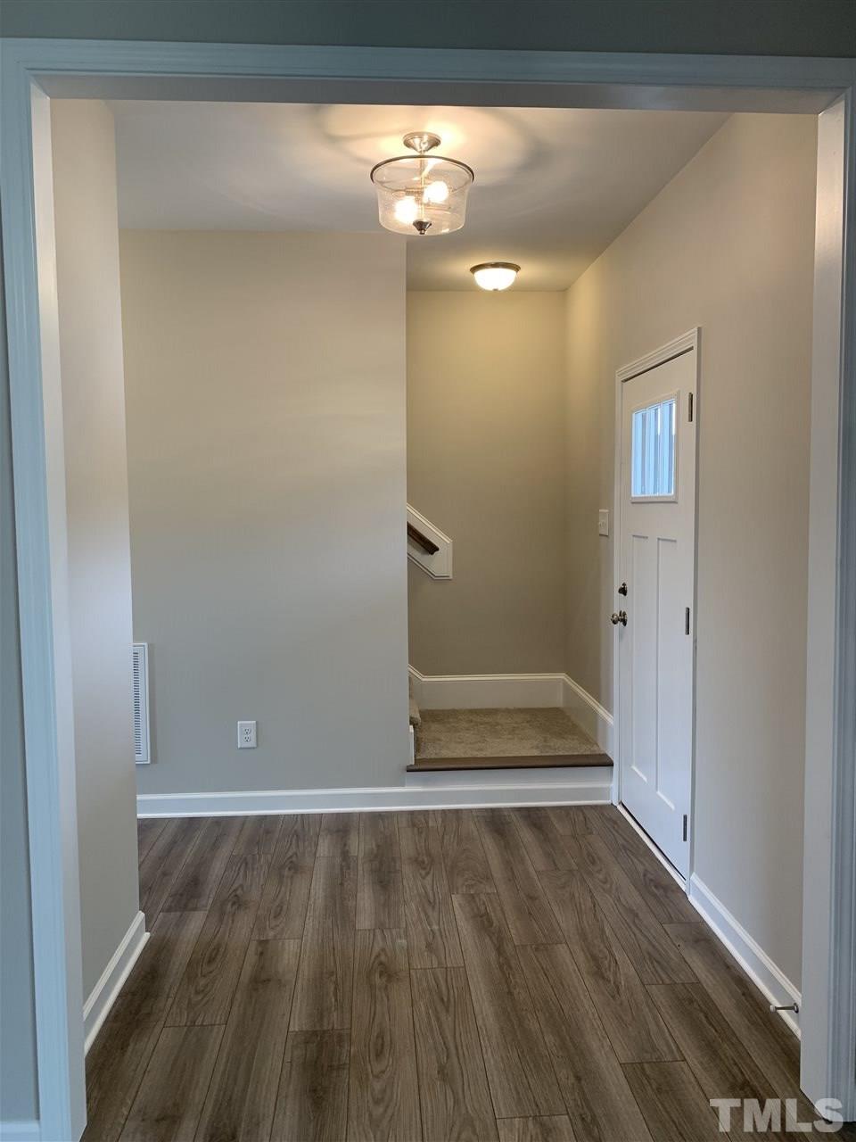 7829 Creech Road Middlesex, NC 27557 - Photo 10 of 18 The gracious entry will lead you upstairs. You will also find a 1/2 bath and a coat closet off of the entryway