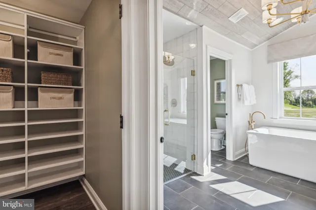 a bathroom with a bathtub and a shower