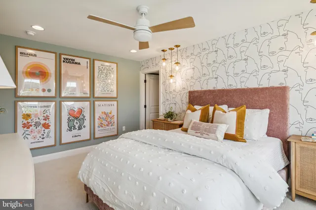 a bedroom with a large bed and a window