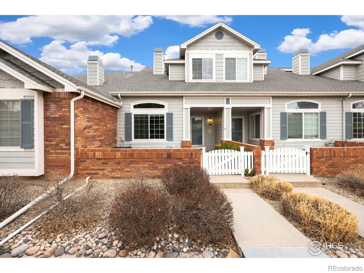 4500 Seneca Street, Unit 66 Fort Collins, CO 80526 - Photo 2 of 20 a front view of a house with a yard