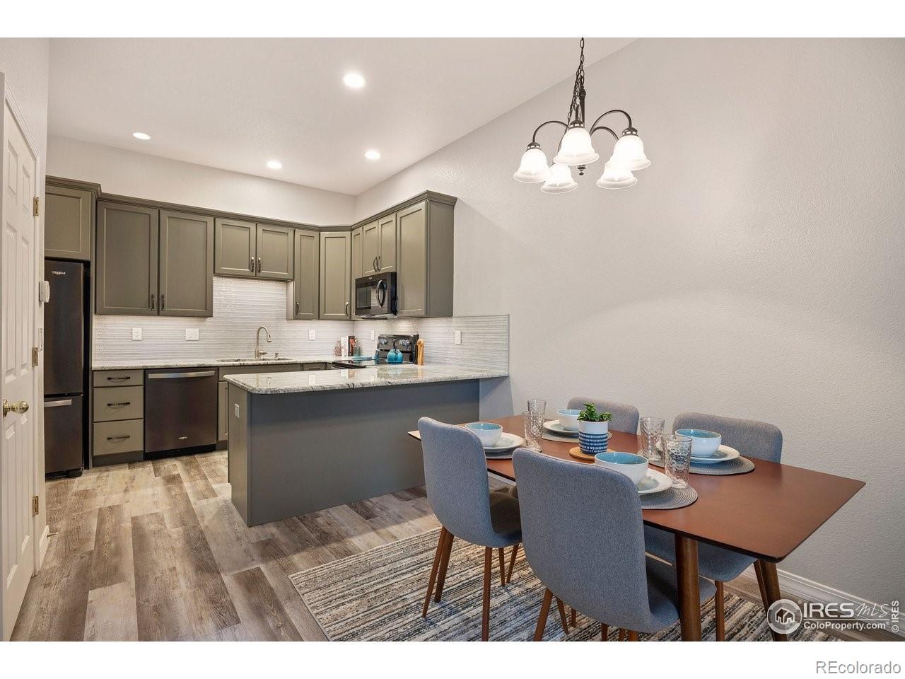 4500 Seneca Street, Unit 66 Fort Collins, CO 80526 - Photo 9 of 20 a kitchen with a table and chairs in it
