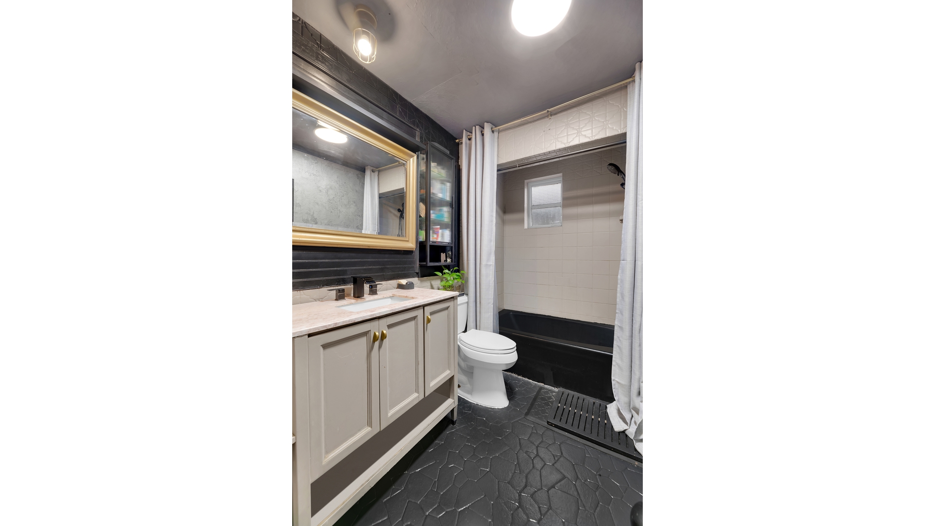 1546 Canarsie Road Brooklyn, NY 11236 - Photo 11 of 15 a bathroom with a sink and a toilet