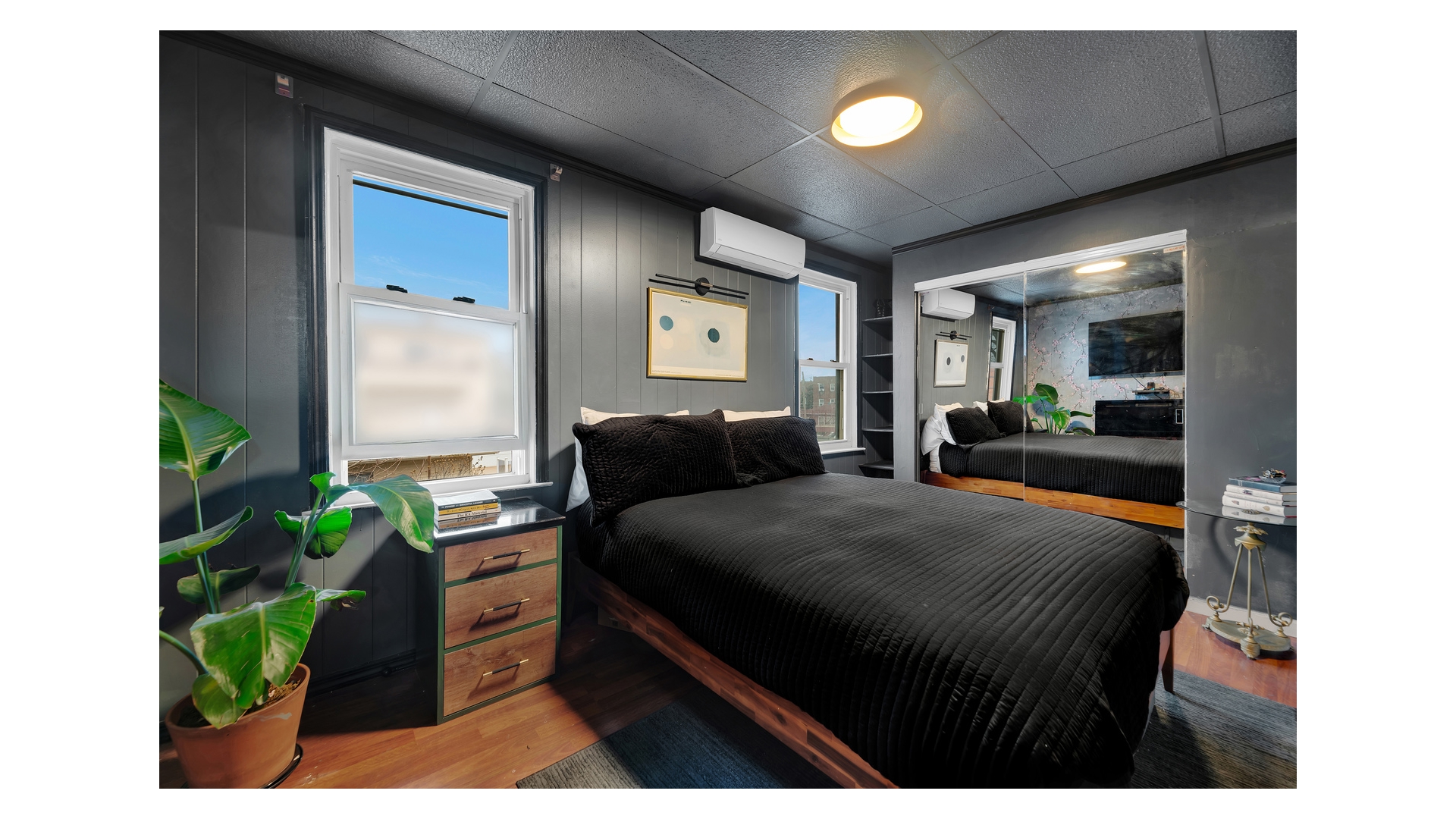 1546 Canarsie Road Brooklyn, NY 11236 - Photo 9 of 15 a bedroom with a bed and a potted plant