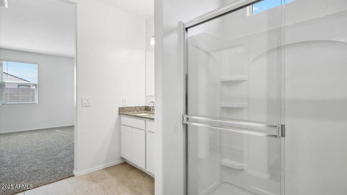 9517 South Mara Drive Apache Junction, AZ 85120 - Photo 14 of 19 a view of walk in closet with empty racks