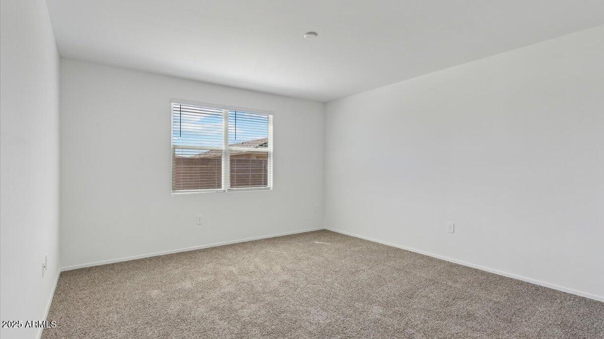 9517 South Mara Drive Apache Junction, AZ 85120 - Photo 16 of 19 an empty room with a window
