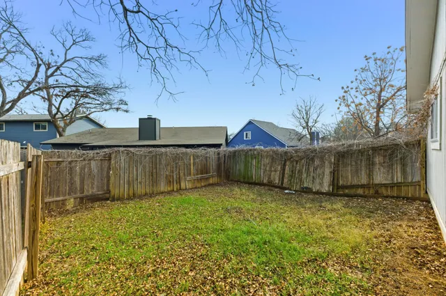 a backyard of a house with lots of green space