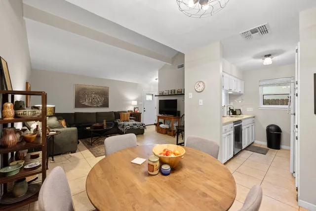 a kitchen with sink refrigerator and cabinets