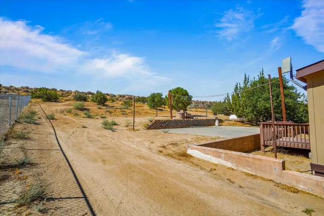 a view of a swimming pool with a lounge chair