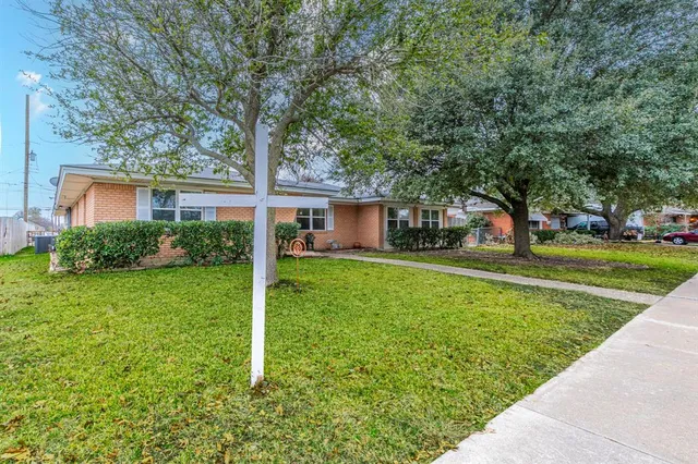 a house view with a garden space
