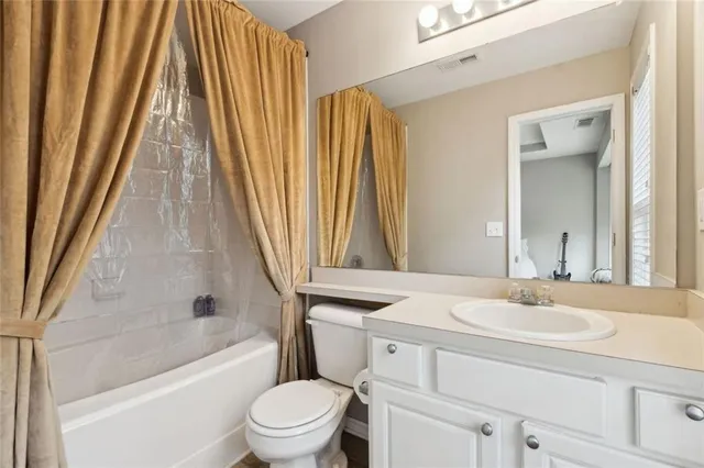 a bathroom with a sink a toilet and a bathtub