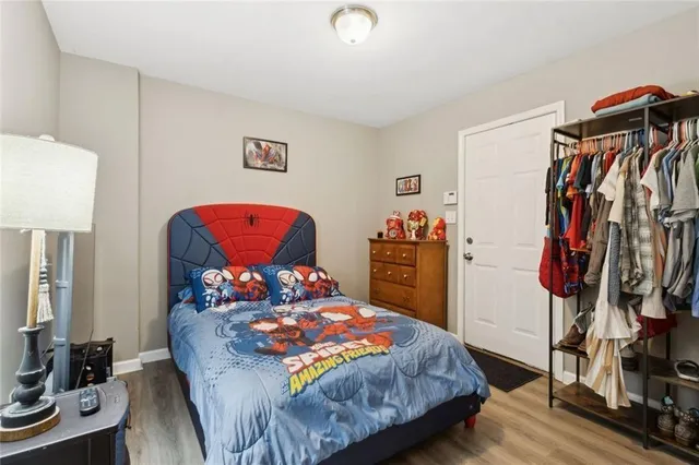 a bedroom with a bed and a tv in it