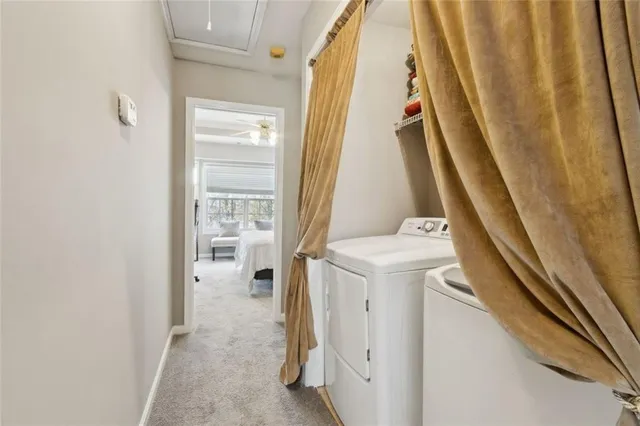 a view of a house with a deck and furniture