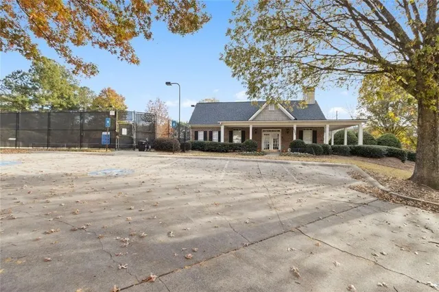 a view of an outdoor space and tennis court