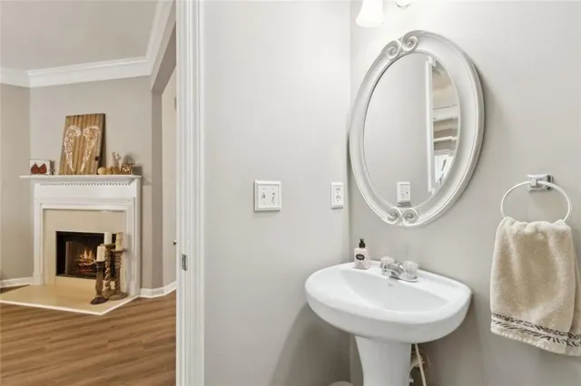 a bathroom with a sink a mirror and a toilet