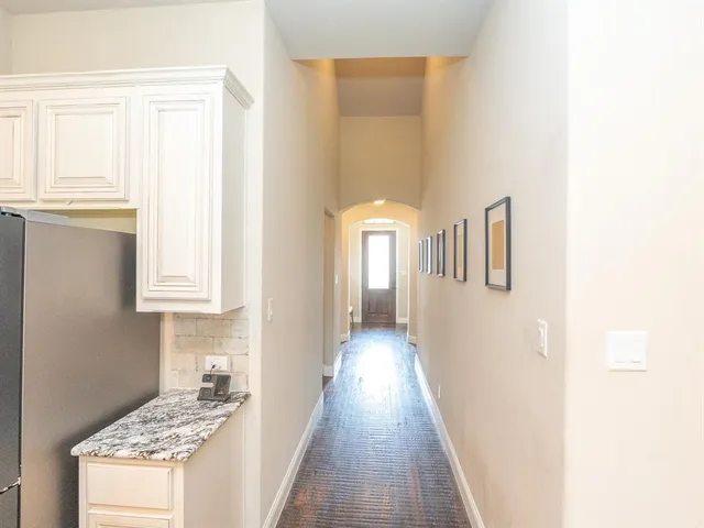 a view of a hallway with windows