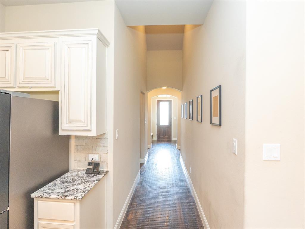 216 Nathan Drive Princeton, TX 75407 - Photo 6 of 12 a view of a hallway with windows
