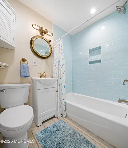 a bathroom with a toilet a sink and a bathtub