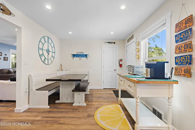 a room with stainless steel appliances granite countertop a stove and a sink