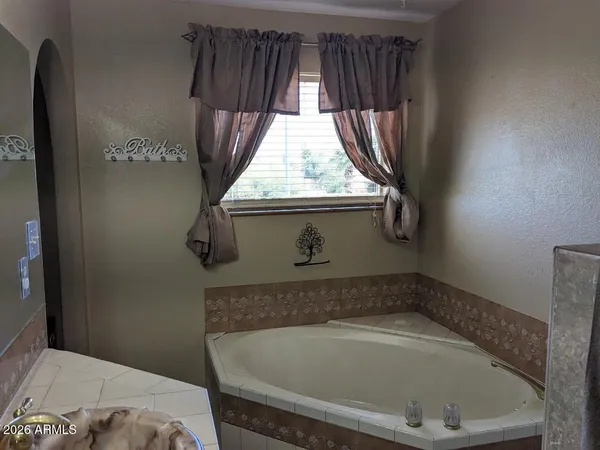 a bathroom with a tub and sink