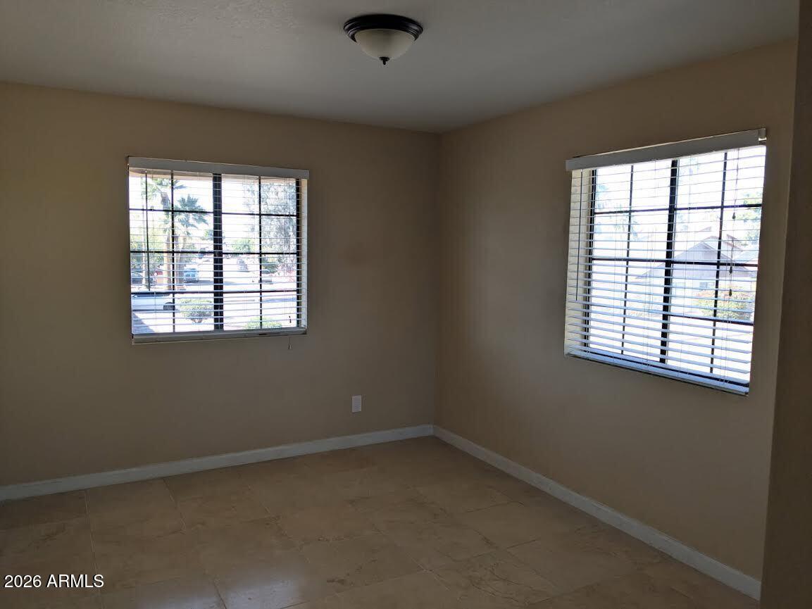1341 North Pomeroy Mesa, AZ 85201 - Photo 13 of 32 an empty room with a window