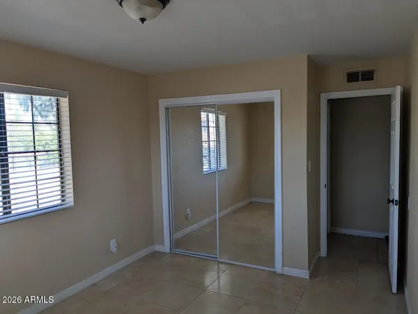 an entryway view with wooden floor