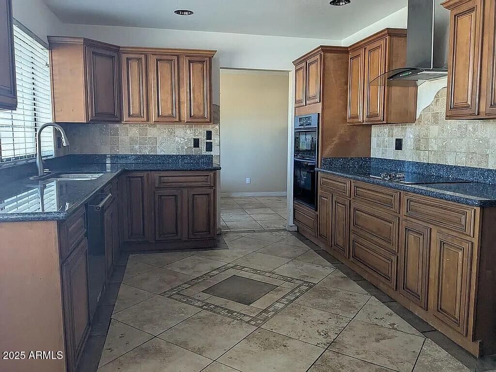 1341 North Pomeroy Mesa, AZ 85201 - Photo 6 of 32 a kitchen with stainless steel appliances granite countertop a sink and cabinets