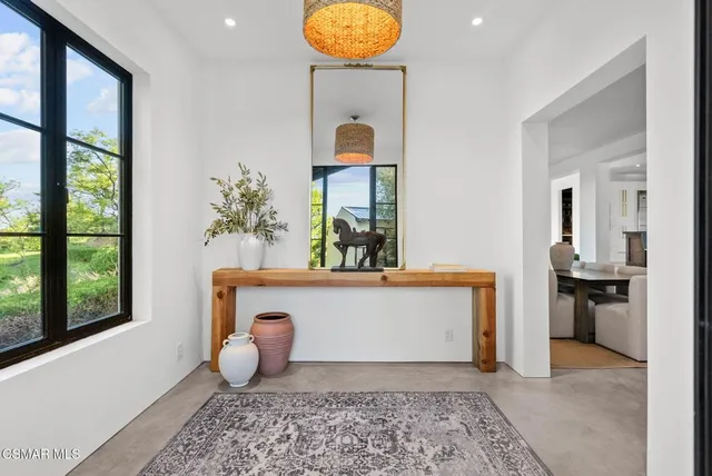 a view of a living room and workspace