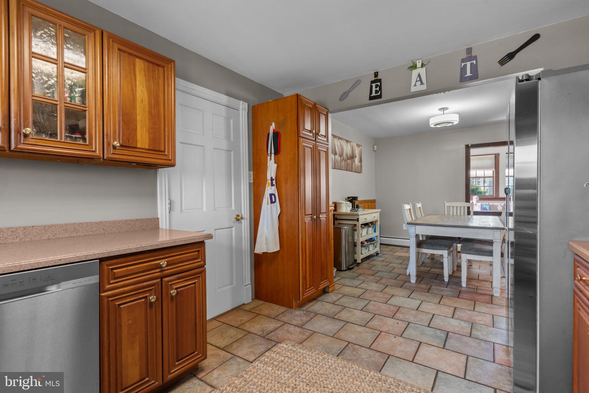 21 Downhill Road Levittown, PA 19056 - Photo 14 of 28 a kitchen with stainless steel appliances granite countertop a refrigerator and a stove