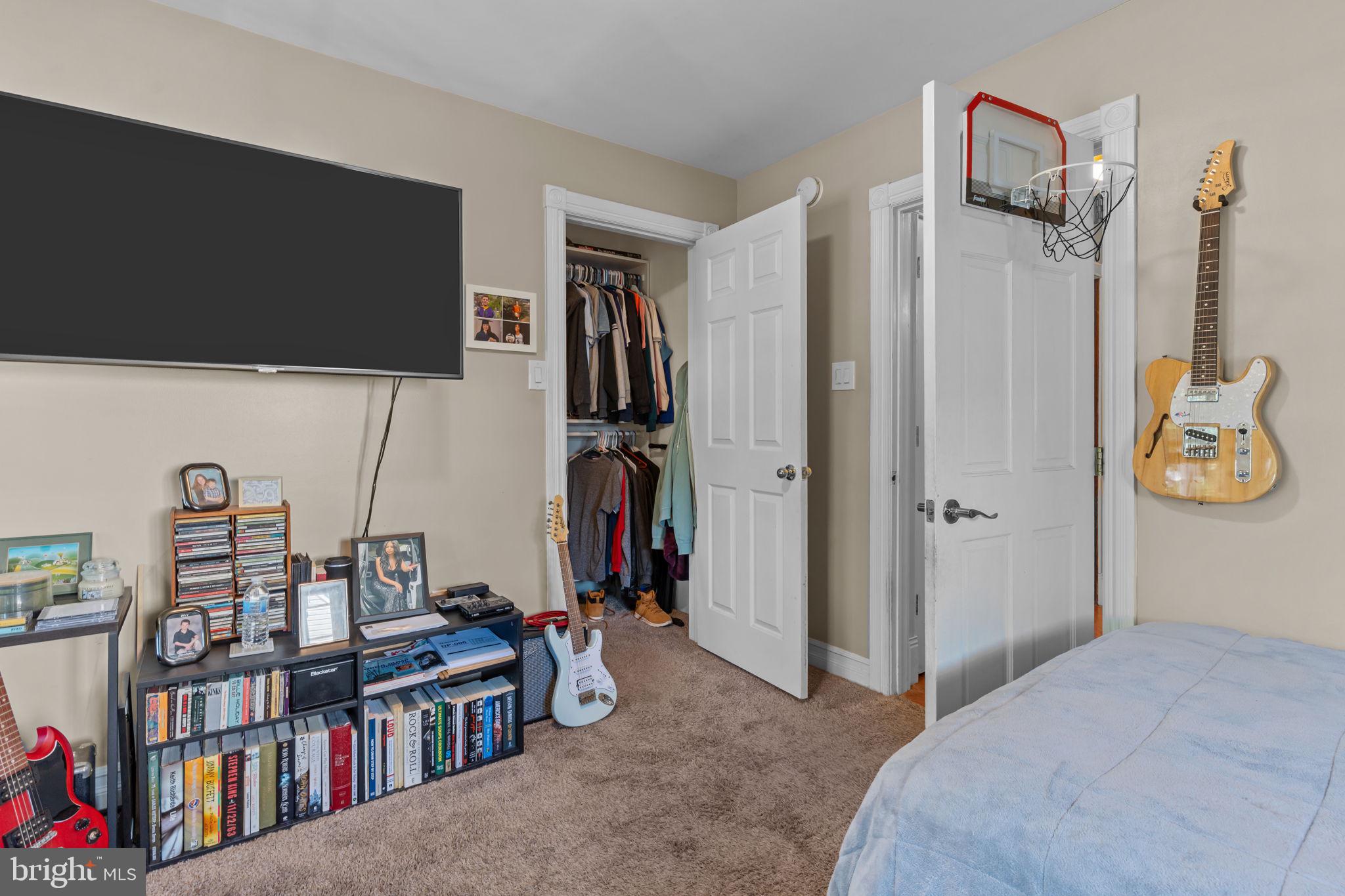 21 Downhill Road Levittown, PA 19056 - Photo 18 of 28 a view of a livingroom with furniture and a flat screen tv